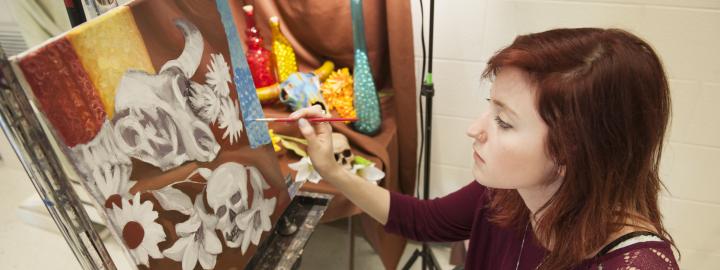 A student working in a painting lab