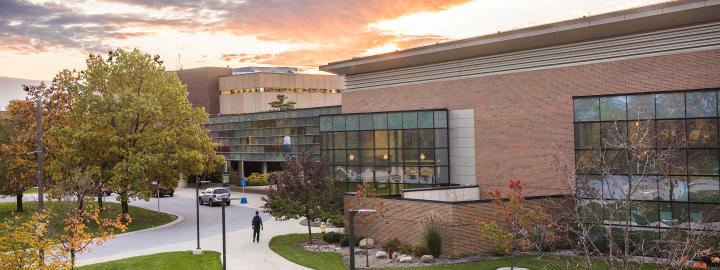 Campus sunset over walb union, helmke library, and the skybridge connecting the two buildings.