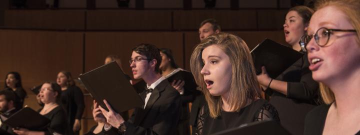 Students performing on stage.