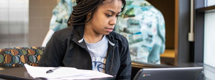 Student studying her class notes.