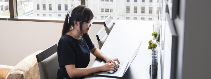 A female accounting student in a downtown office