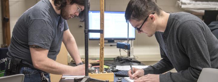 Physics student working on a lab experiment.