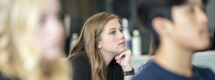 Student listening to lecture.