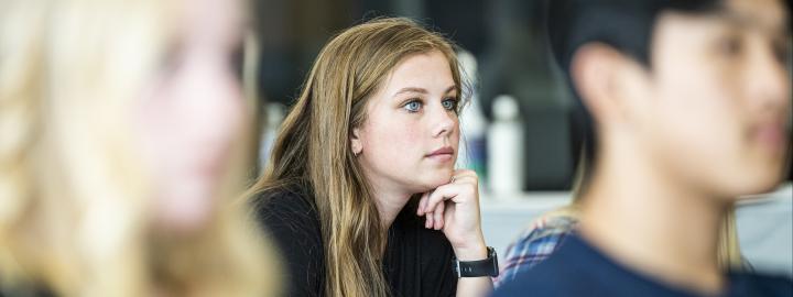 Student listening to lecture.