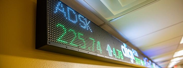 Close up of the stock market ticker tape.