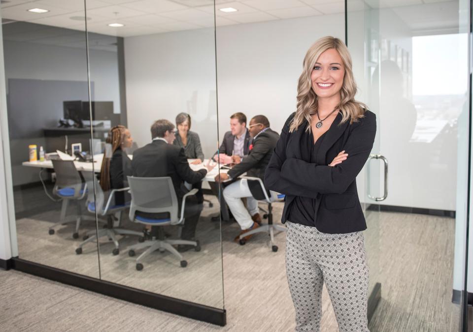 Female business student posing indoors.