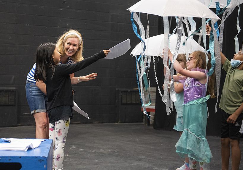 Gloria Minnich discusses gives some direction during a theatre class.