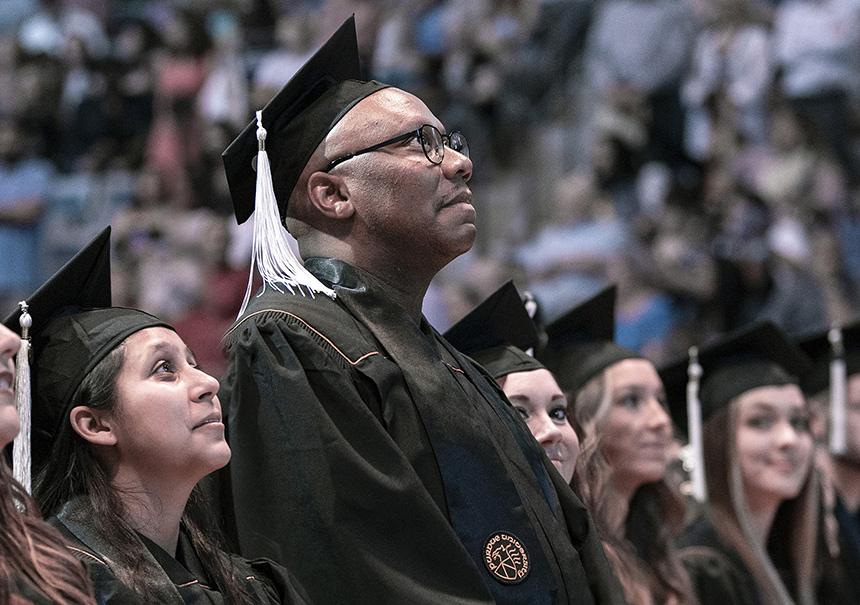 De'Onte Brewer looking up at the crowd at commencement