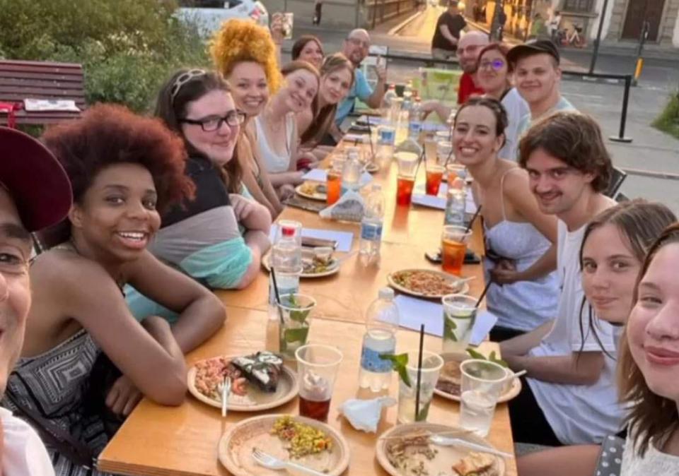 Students eating dinner outside in Florence, Italy