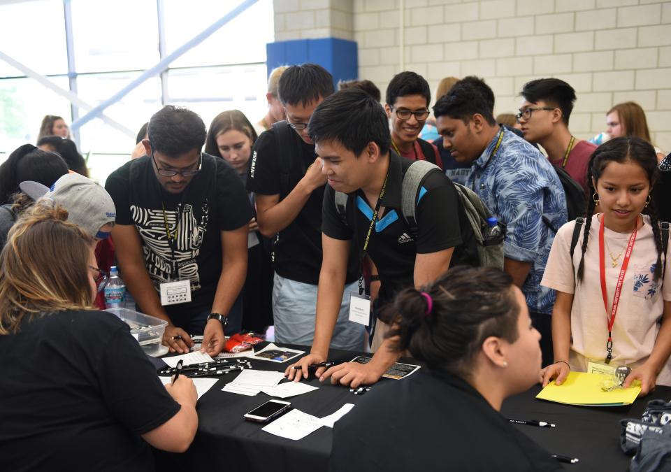 Students at booth at event