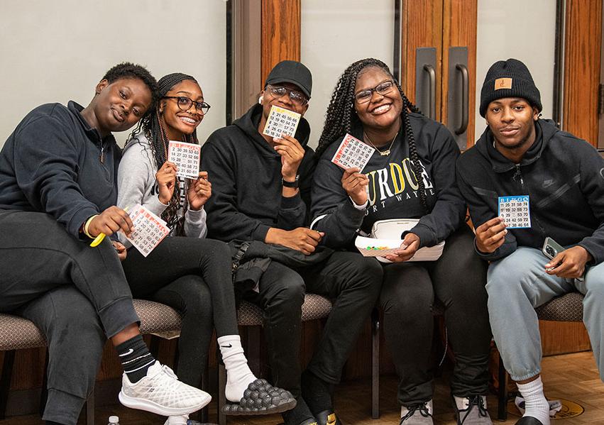 Smiling students at a bingo game