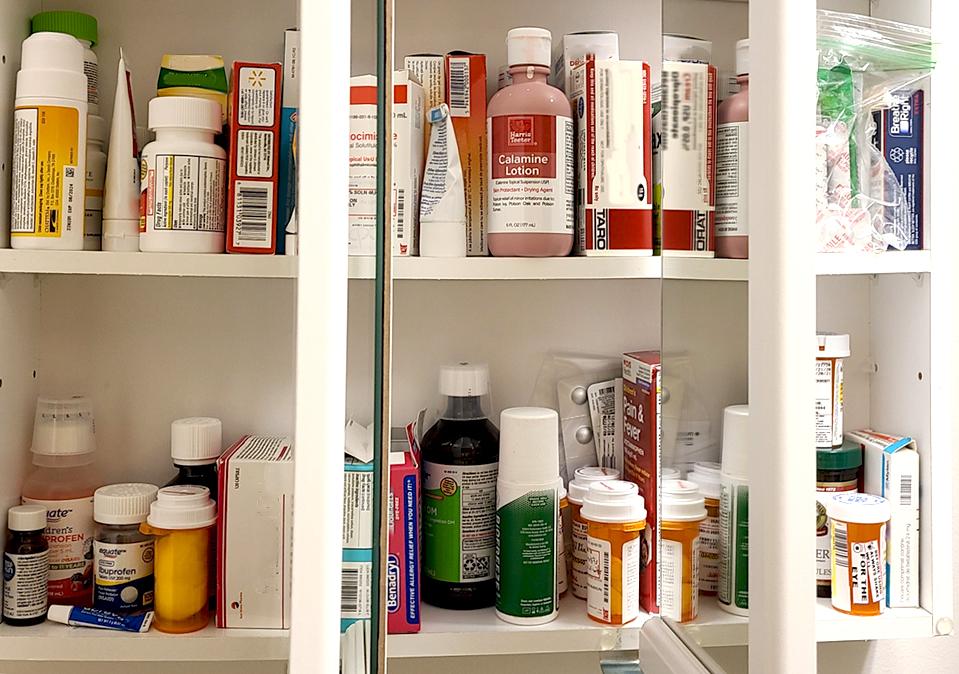 Open medicine cabinet displaying medications