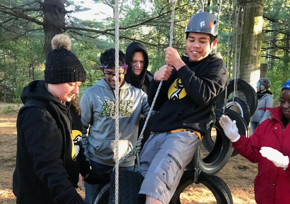 Students on ropes course