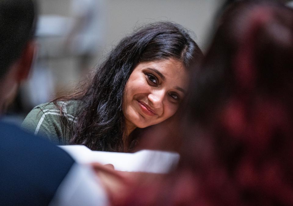 A student smiles toward the camera during orientation.