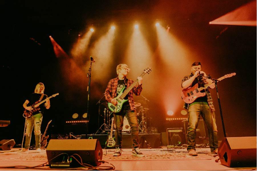 students performing on stage
