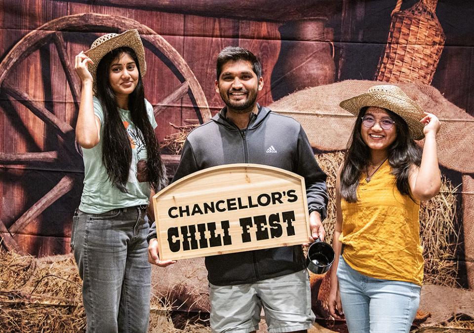 Three students at the Chancellor's Chili Fest