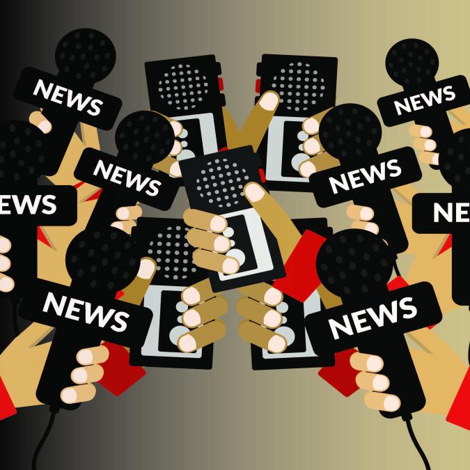 Several hands holding news microphones.
