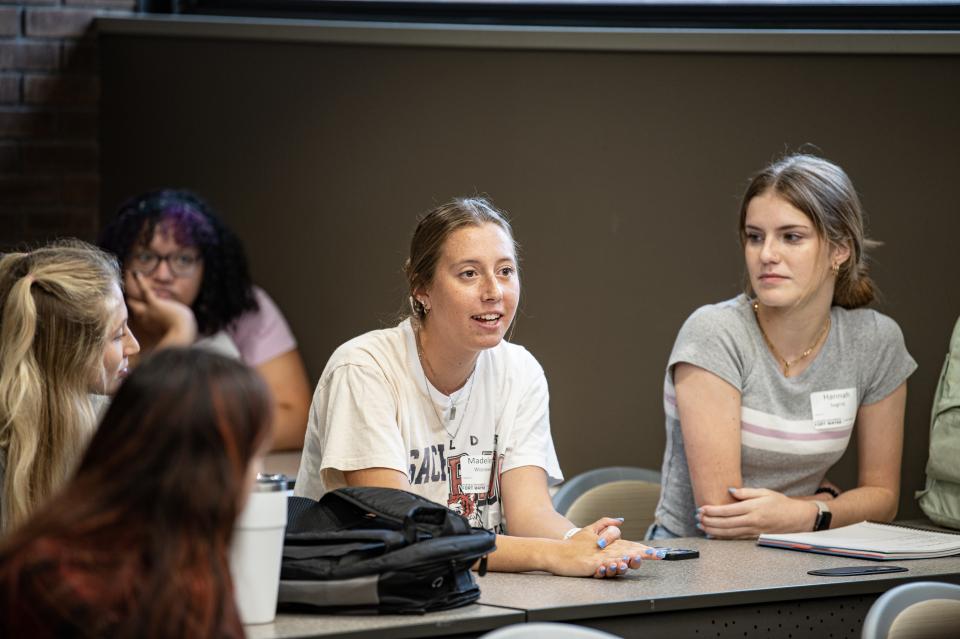 women in classroom setting in honors program suite
