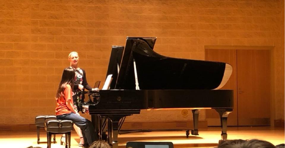 young girl playing piano