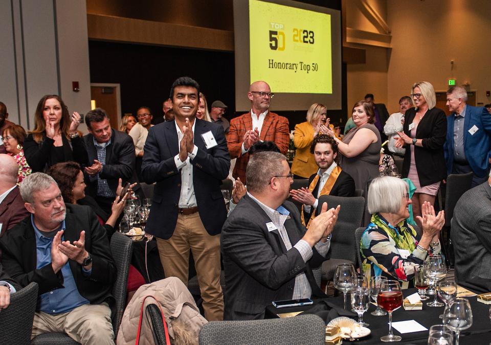 People are clapping at the 2023 Top 50 event