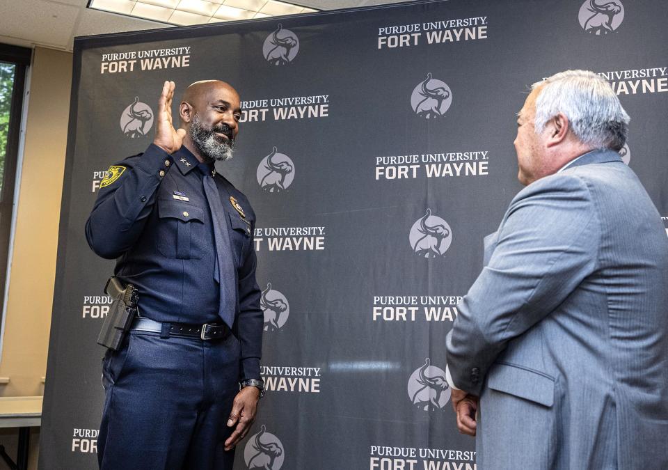 Chief Anthony Harrison was sworn in by Glen Nakata, PFW’s vice chancellor for financial and administrative affairs.