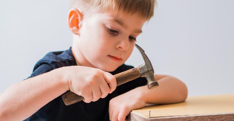 child making wood blocks