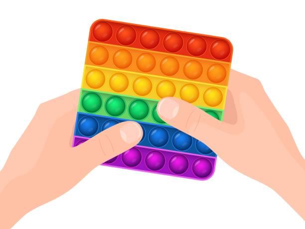 two hands holding a rainbow colored pop it fidget
