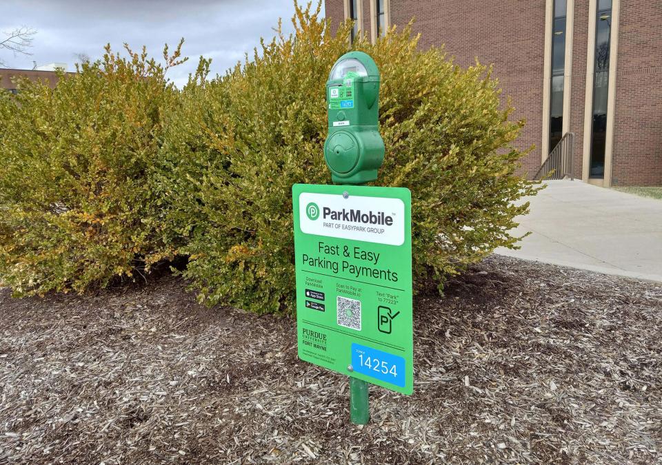 A ParkMobile sign on a parking meter at PFW