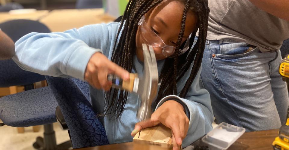 child making wooden creation