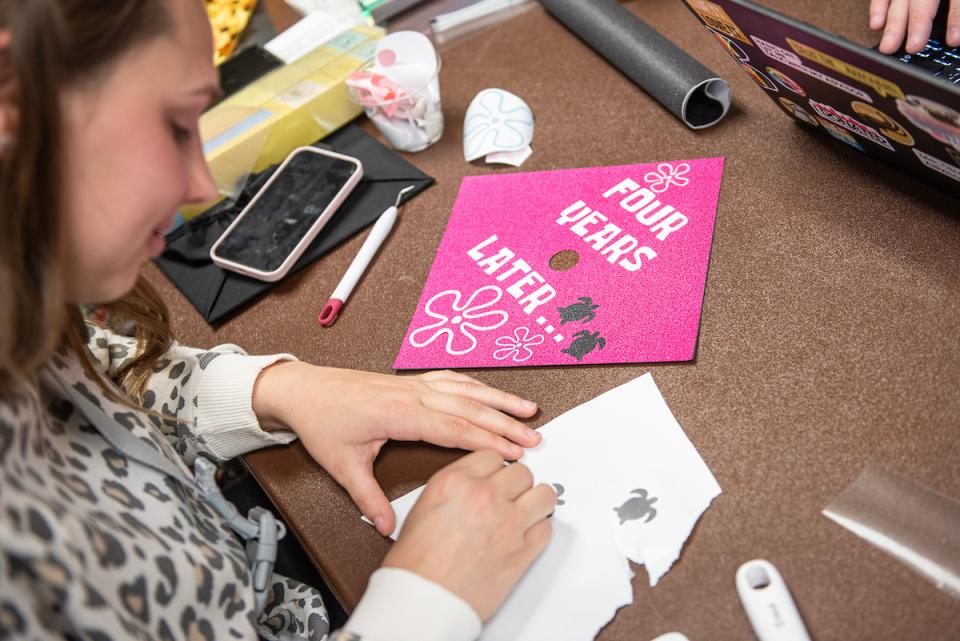 PFW senior decorates a cap for commencement.