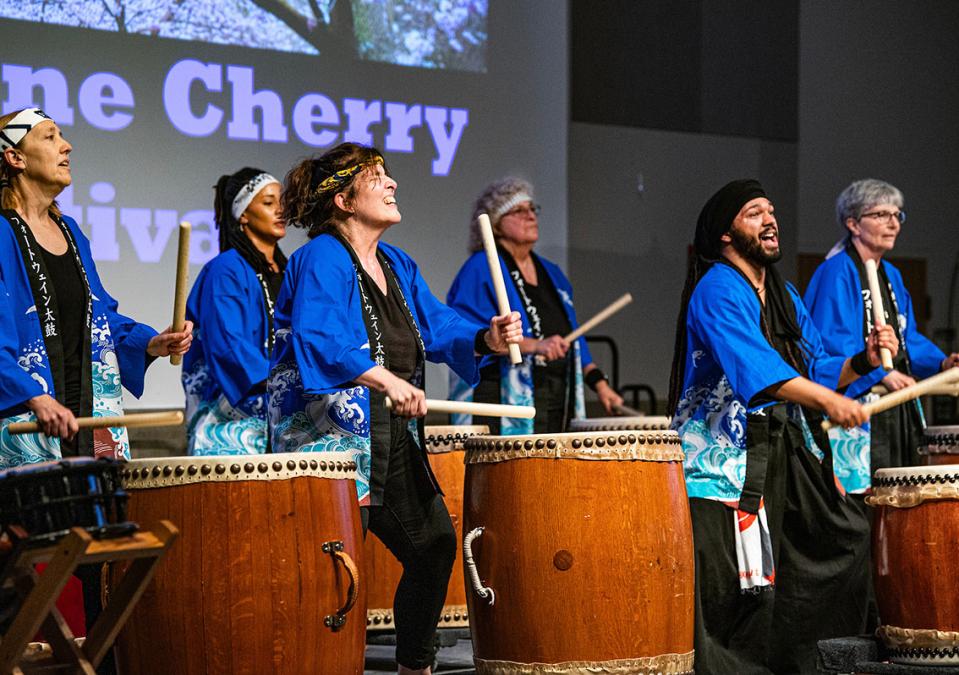 Taiko drummers are performing at the Cherry Blossom Festival