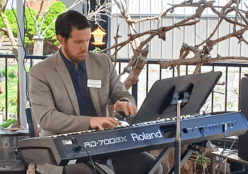 Jonathan Young playing a piano