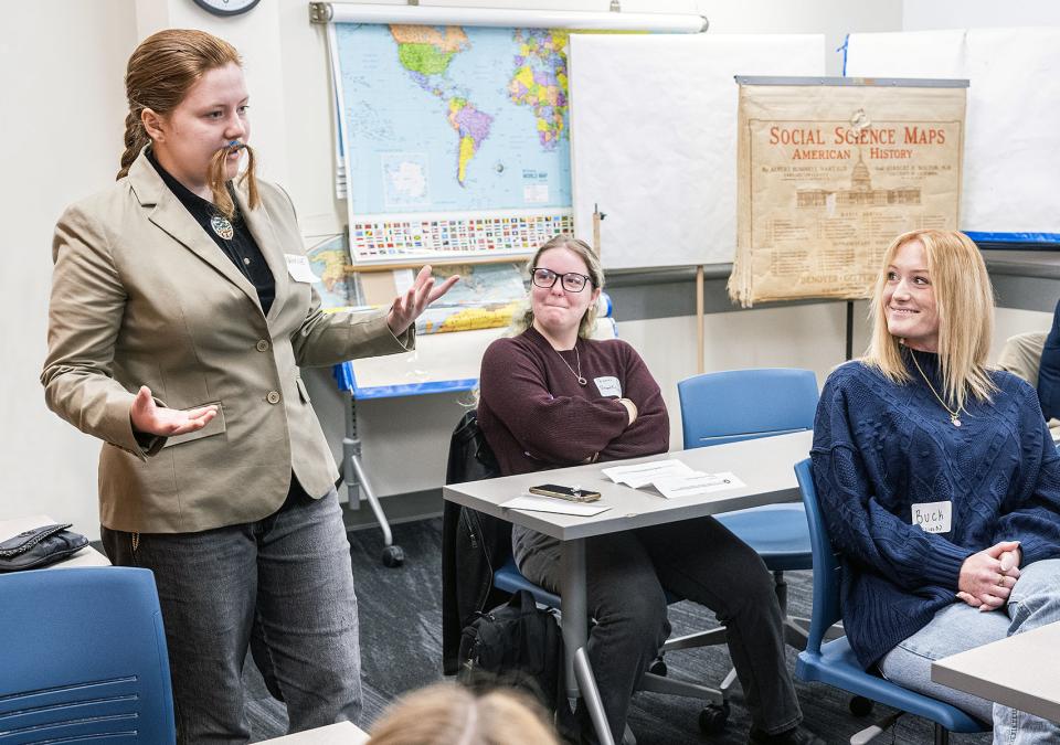 A student is giving a history class presentation