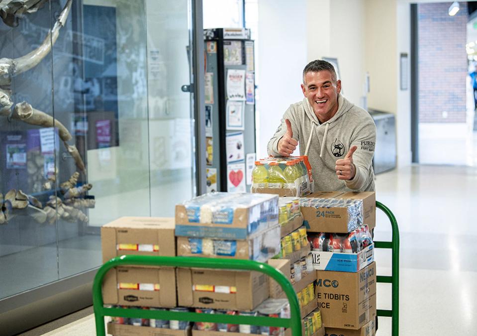 Eric Manor is moving items into a food pantry