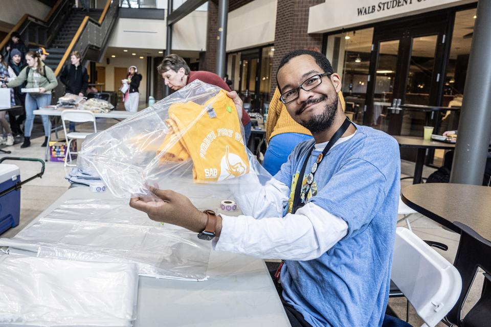 Photo of student making a kit