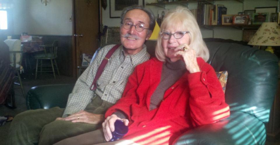 old couple sitting on couch