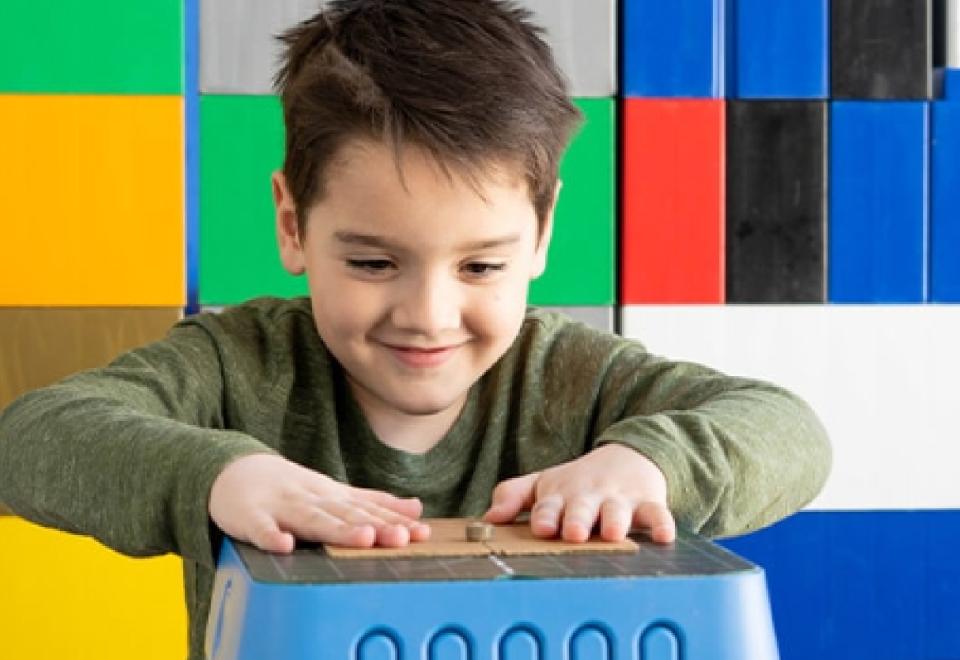child playing with paper