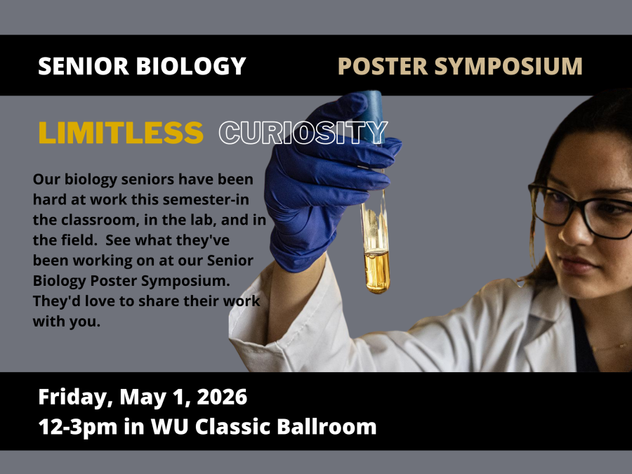 Biology student in lab coat holding test tube