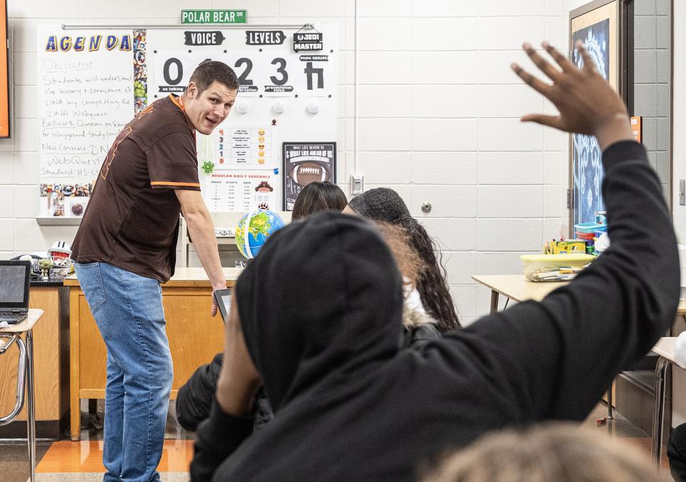 Jared McMullen is looking a a student who is raising their hand