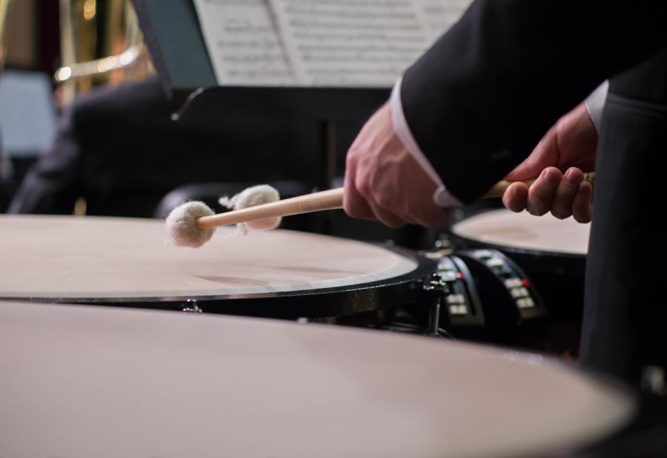 percussionist performing on timpani