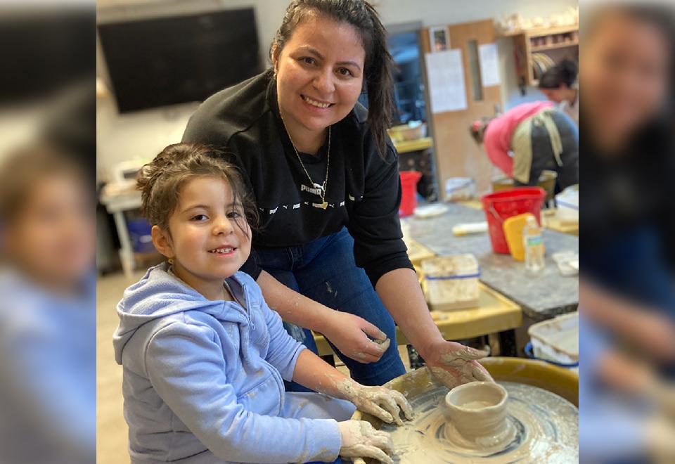 child making clay pottery
