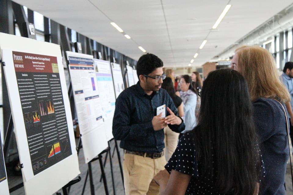 Student Presenting Project on Board