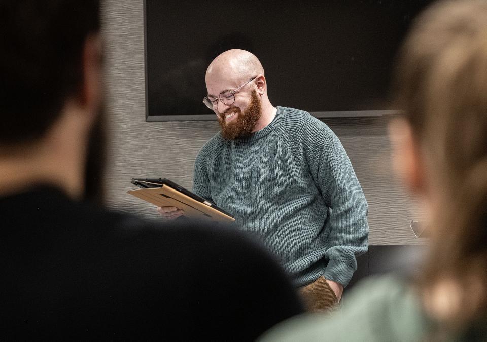 Eden Bailey is reading a poem in a classroom