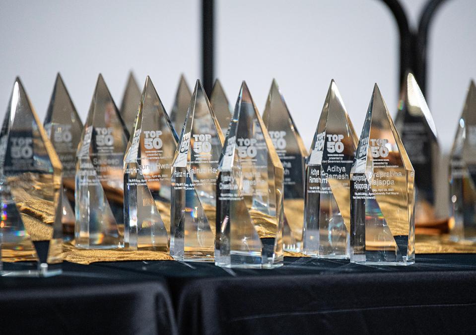 Several Top 50 awards are on a table