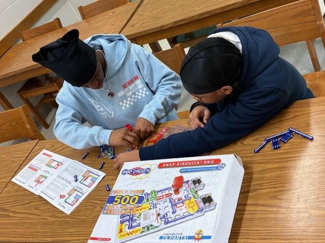 High School students working on circuit connection activity together