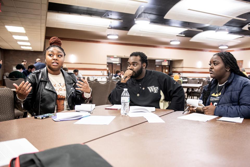 Students discussing at table