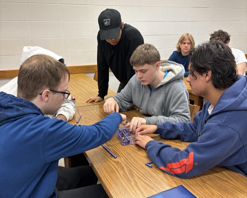 students working on circuit connection activity as a group