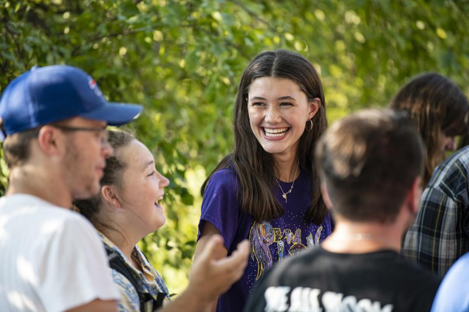 Students gathering outside laughing