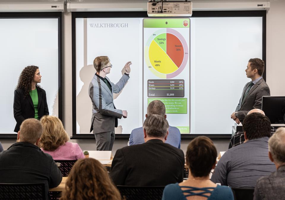 Students presenting at a confernce.