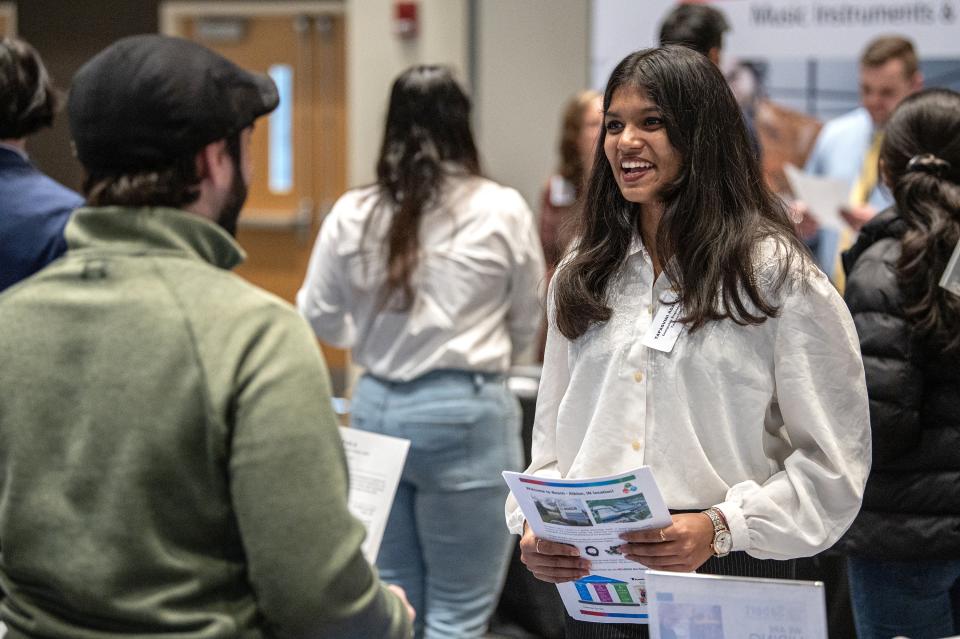 Student speaking with prospective future employer